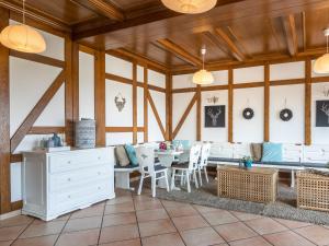 a dining room with a table and chairs at Spacious Holiday Home in Gouvy with Garden in Gouvy