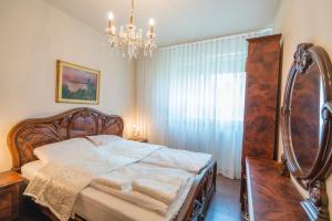 Posteľ alebo postele v izbe v ubytovaní Royal Luxus Wellness Apartman