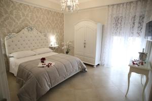Postel nebo postele na pokoji v ubytování B&B Pompei Olympus