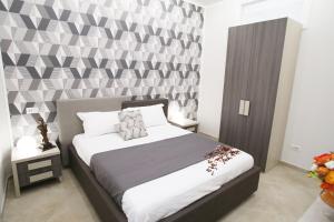 Postel nebo postele na pokoji v ubytování B&B Pompei Olympus