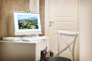 TV a/nebo společenská místnost v ubytování B&B Pompei Olympus