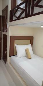 Un ou plusieurs lits dans un hébergement de l'établissement Pondok Aldi