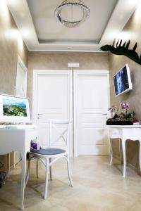 TV a/nebo společenská místnost v ubytování B&B Pompei Olympus