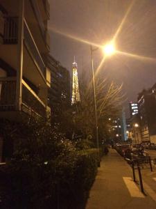 a street light with a building in the background at Lovely Flat Champs de Mars Eiffel in Paris