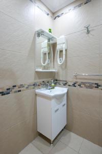 Kylpyhuone majoituspaikassa Apartments Holiday Lux