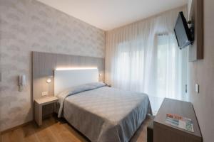 Postel nebo postele na pokoji v ubytování Hotel Fabris