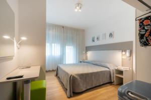 Postel nebo postele na pokoji v ubytování Hotel Fabris