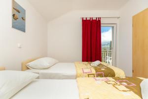 Postel nebo postele na pokoji v ubytování Apartments Vesna