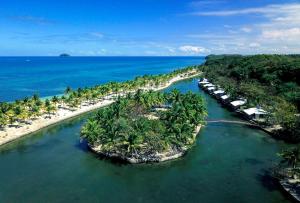 an aerial view of an island in the water at Golden Sands Destination Resorts in Daanbantayan
