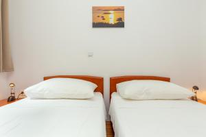 Postel nebo postele na pokoji v ubytování Apartments Vesna