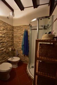 a bathroom with a toilet and a shower and a sink at Casa Lorenza in Portovenere