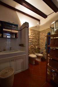 a bathroom with a sink and a toilet in it at Casa Lorenza in Portovenere