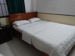 Postel nebo postele na pokoji v ubytování Thuong Hai Hotel