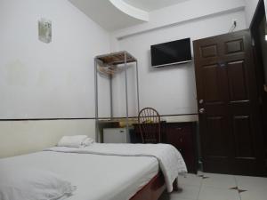Postel nebo postele na pokoji v ubytování Thuong Hai Hotel