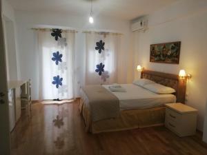 Säng eller sängar i ett rum på Spartila Apartments