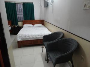 Postel nebo postele na pokoji v ubytování Thuong Hai Hotel