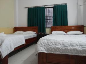 Postel nebo postele na pokoji v ubytování Thuong Hai Hotel