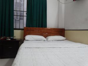 Postel nebo postele na pokoji v ubytování Thuong Hai Hotel
