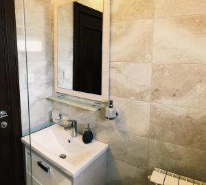 Ein Badezimmer in der Unterkunft Galiot Apartman