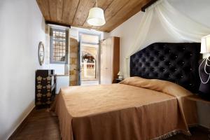 Postel nebo postele na pokoji v ubytování Casa Perla Suites