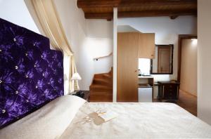 Postel nebo postele na pokoji v ubytování Casa Perla Suites