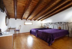 Postel nebo postele na pokoji v ubytování Casa Perla Suites