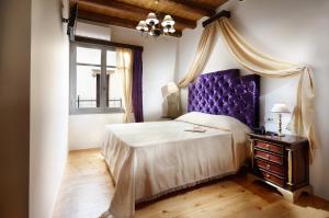 Postel nebo postele na pokoji v ubytování Casa Perla Suites