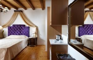 Postel nebo postele na pokoji v ubytování Casa Perla Suites