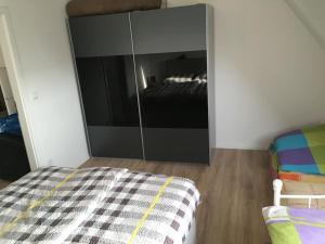 a bedroom with a bed and a large mirror at Cityflair Apartments in Berlin