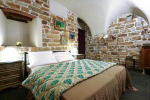 Postel nebo postele na pokoji v ubytování I Valloni Apartments