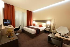 TV a/nebo společenská místnost v ubytování Hotel Galaxy
