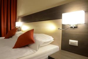 Postel nebo postele na pokoji v ubytování Hotel Galaxy