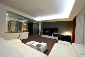 TV a/nebo společenská místnost v ubytování Hotel Galaxy