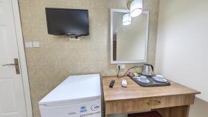 TV a/nebo společenská místnost v ubytování Cihangir Palace Hotel