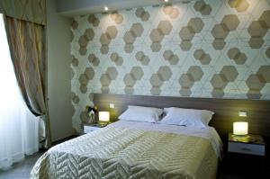 Postel nebo postele na pokoji v ubytování B&B Albachiara