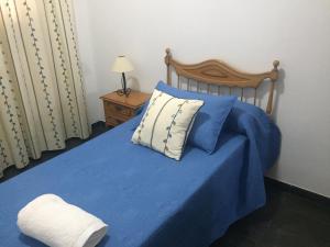 מיטה או מיטות בחדר ב-Apartamentos Hautacuperche