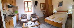 Postel nebo postele na pokoji v ubytování Spanos House