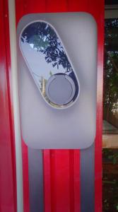 a window with a picture of a tree on it at Apollonia Hotel Apartments in Varkiza