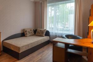 Кровать или кровати в номере Apartment on Meža prospekts