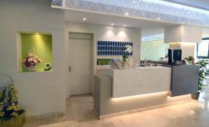 a lobby with a counter in a store at Hotel Adele in Bellaria-Igea Marina