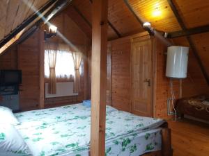 Postel nebo postele na pokoji v ubytování Колорит