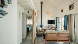 a living room with a couch and a table at Villa Natura in Vila do Porto