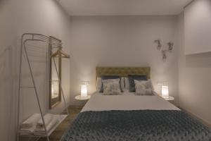 Voodi või voodid majutusasutuse TRIA NOMINA Apartamentos Turísticos toas