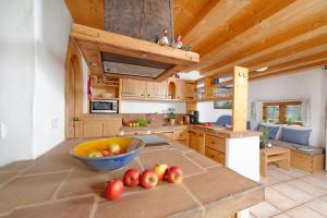 a kitchen with a bowl of apples on a counter at Hagerhof in Eggstätt