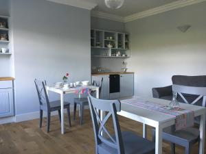 a dining room with a table and chairs at Ferney House in Irvinestown