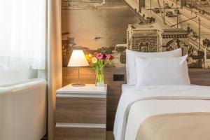 Postel nebo postele na pokoji v ubytování Hotel Royal Inn