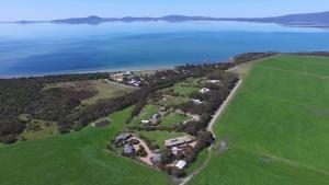 an aerial view of a large estate next to the water at Limosa Rise in Yanakie