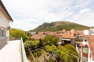 a view of a town with a mountain in the background at Rooms-Sema in Mostar