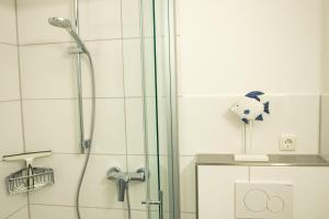 Ванная комната в Haus am Deich Wohnung 11