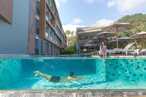 Bazén v ubytování The Nature Phuket - SHA Extra Plus nebo v jeho okolí